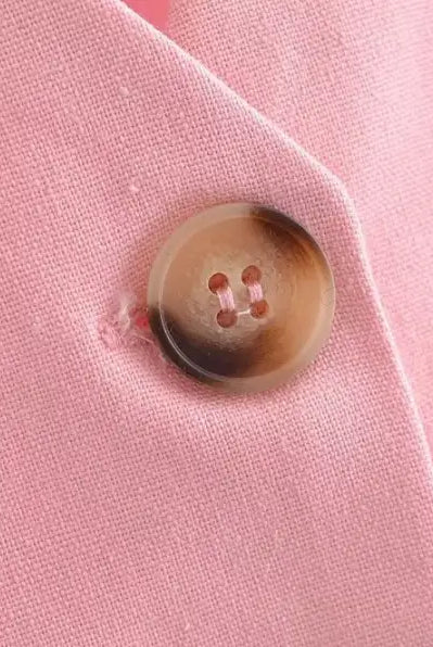 Elegant French style pink fabric with a brown button for sleeveless V-Neck polyester top