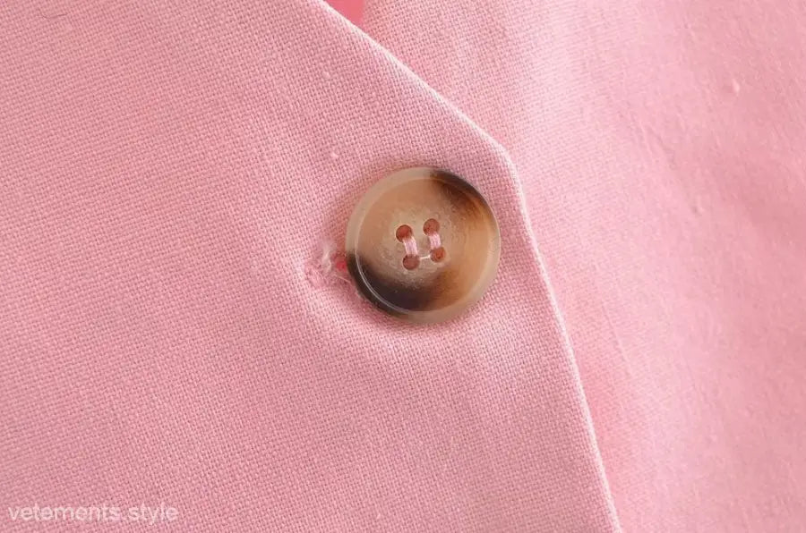 Elegant French style pink fabric with a brown button for sleeveless V-Neck polyester top