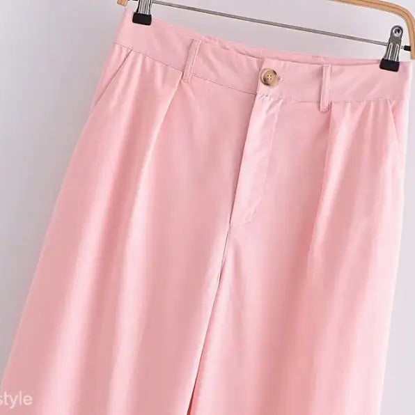 Pink wide-leg trousers in elegant French style displayed with the Sleeveless V-Neck Polyester top