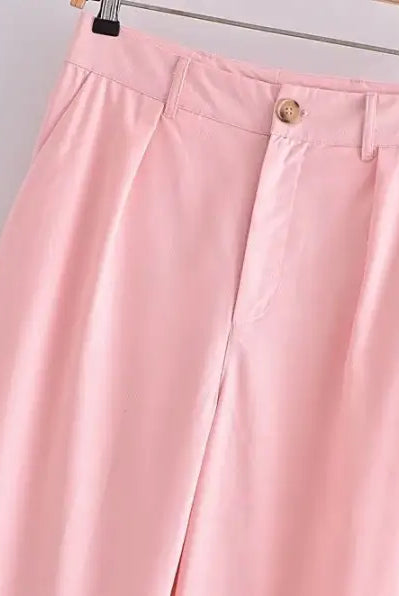 Pink wide-leg trousers in elegant French style displayed with the Sleeveless V-Neck Polyester top