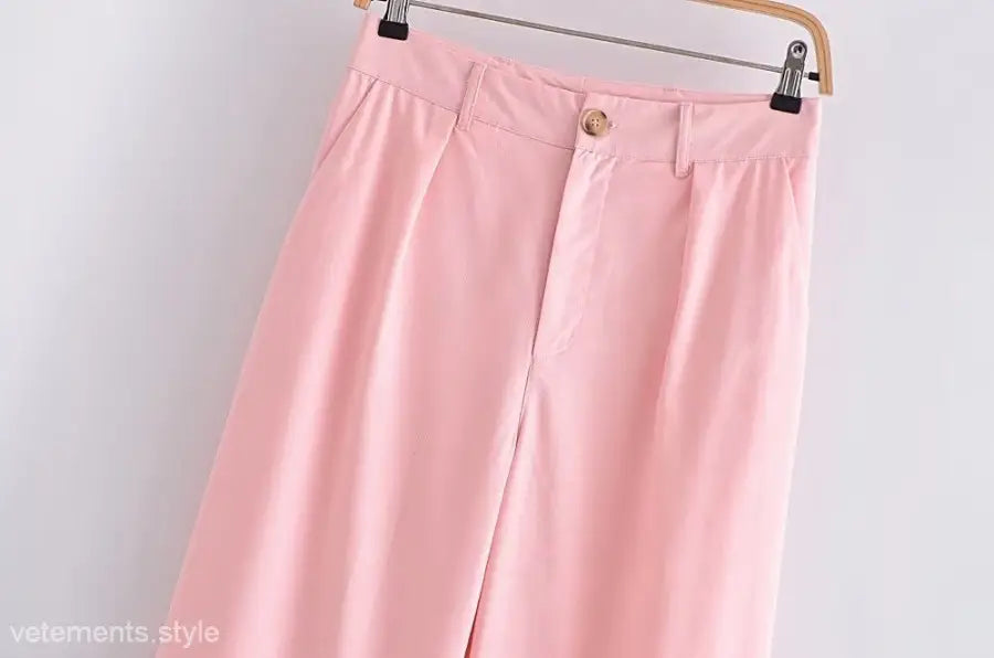 Pink wide-leg trousers in elegant French style displayed with the Sleeveless V-Neck Polyester top