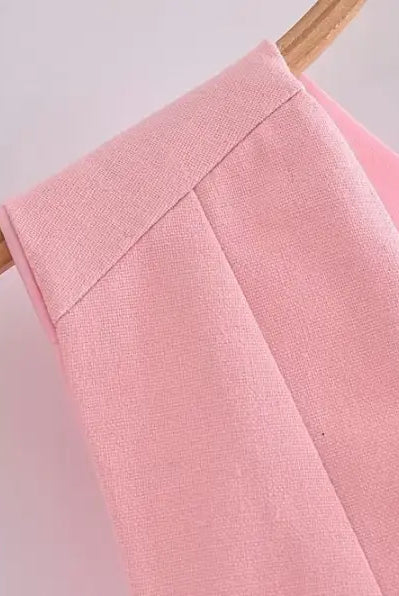 Pink garment on hanger showcasing elegant French style sleeveless V-neck polyester