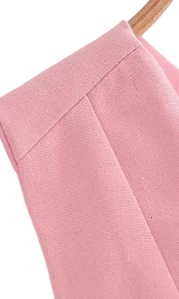 Elegant French style sleeveless V-neck polyester pink garment on hanger