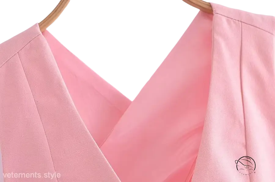 Elegant French style pink v-neck top on hanger