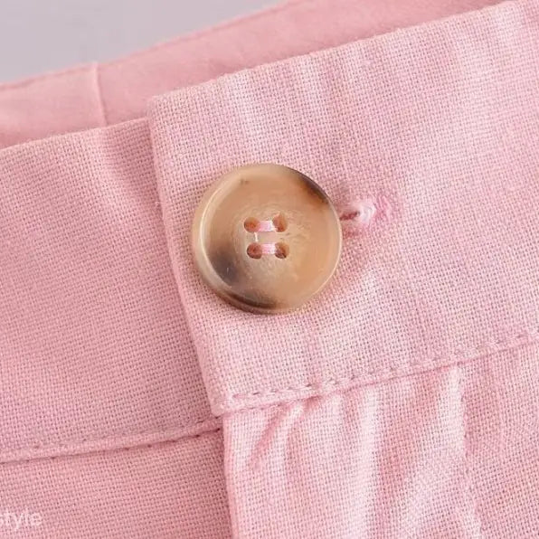 Pink linen pants with button, showcasing elegant French style in high-quality polyester