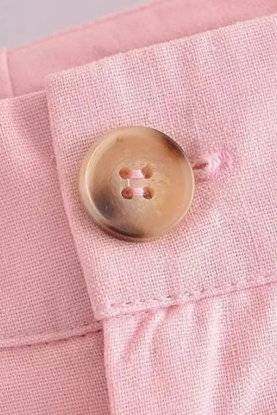 Pink linen pants with button, showcasing elegant French style in high-quality polyester