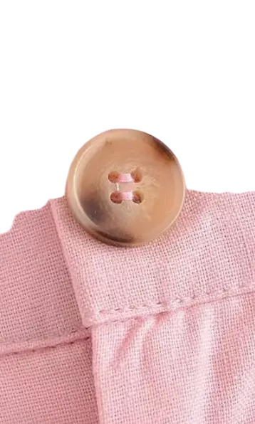 Pink linen pants with button, showcasing elegant French style in high-quality polyester