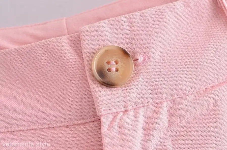 Pink linen pants with button, showcasing elegant French style in high-quality polyester