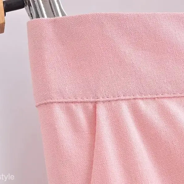 Pink fabric garment waistband of the elegant French style sleeveless V-Neck polyester dress