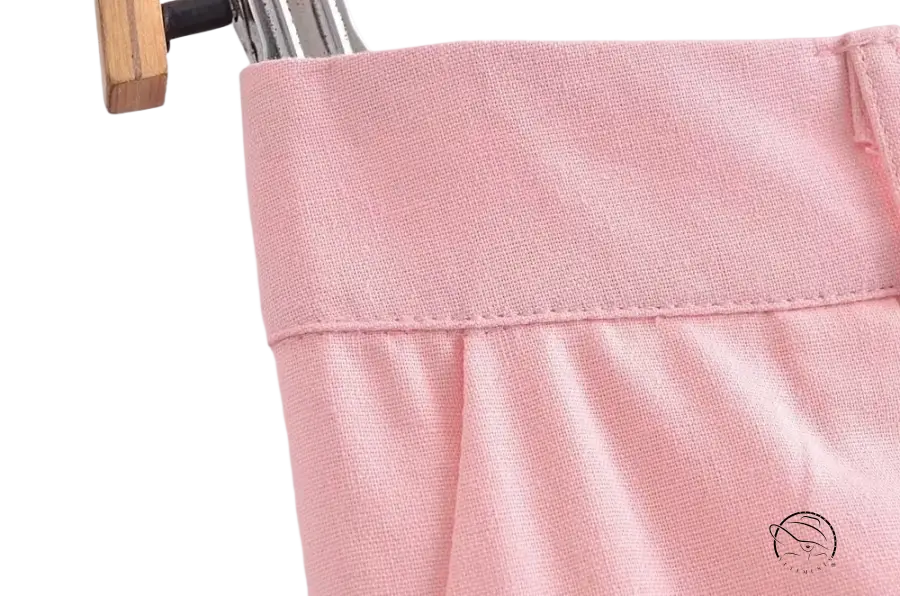 Pink waistband of elegant French style sleeveless V-neck polyester garment