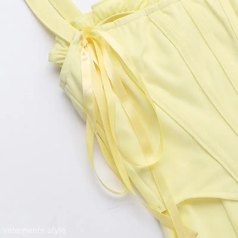 Pale yellow Elegant Girdle Dress with lace accents and spaghetti straps