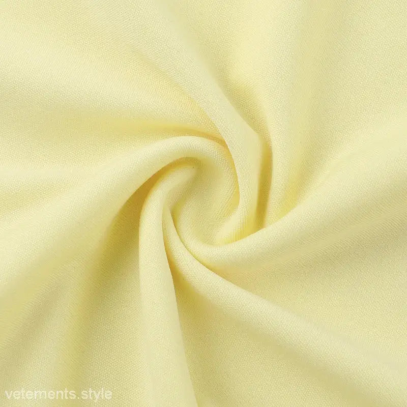 Pale yellow fabric in spiral shape for Elegant Girdle Dress with Lace Accents
