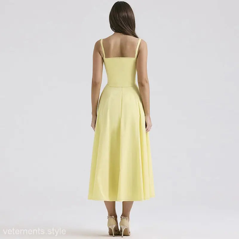 Yellow sleeveless elegant girdle dress with spaghetti straps and flared skirt design