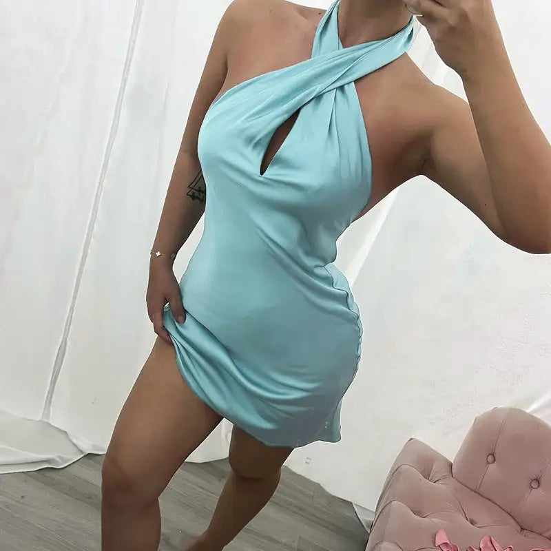 Mint-colored satin halter backless dress with twisted front design for a fashionable look