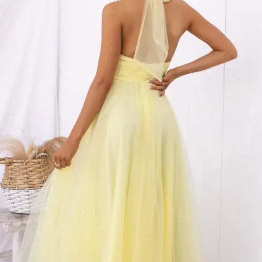 Yellow halter dress showcasing an elegant halter evening dress for summer occasions