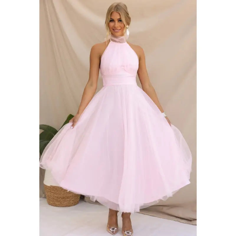 Pink halter-neck tulle dress showcasing an elegant halter evening design for summer occasions