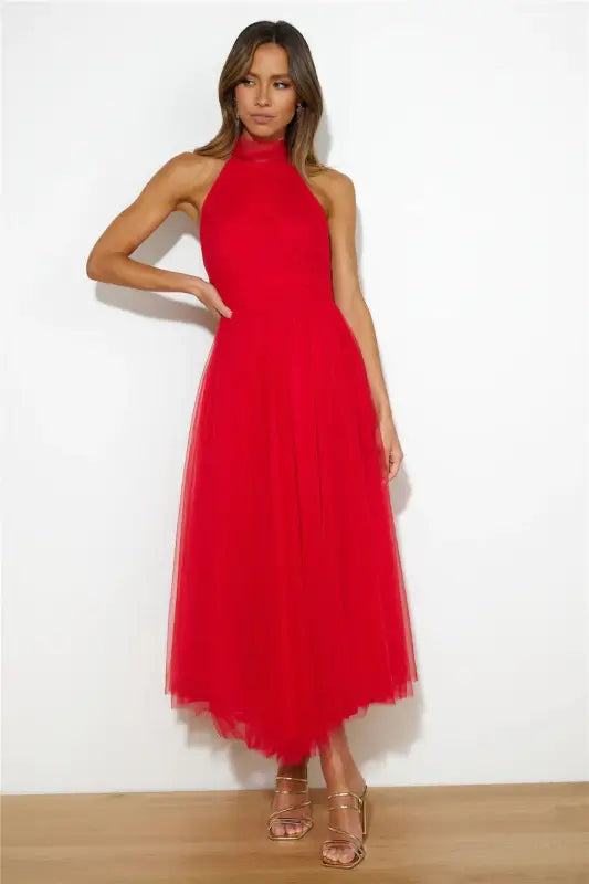 Red halter neck midi dress showcasing an elegant halter evening dress for summer occasions