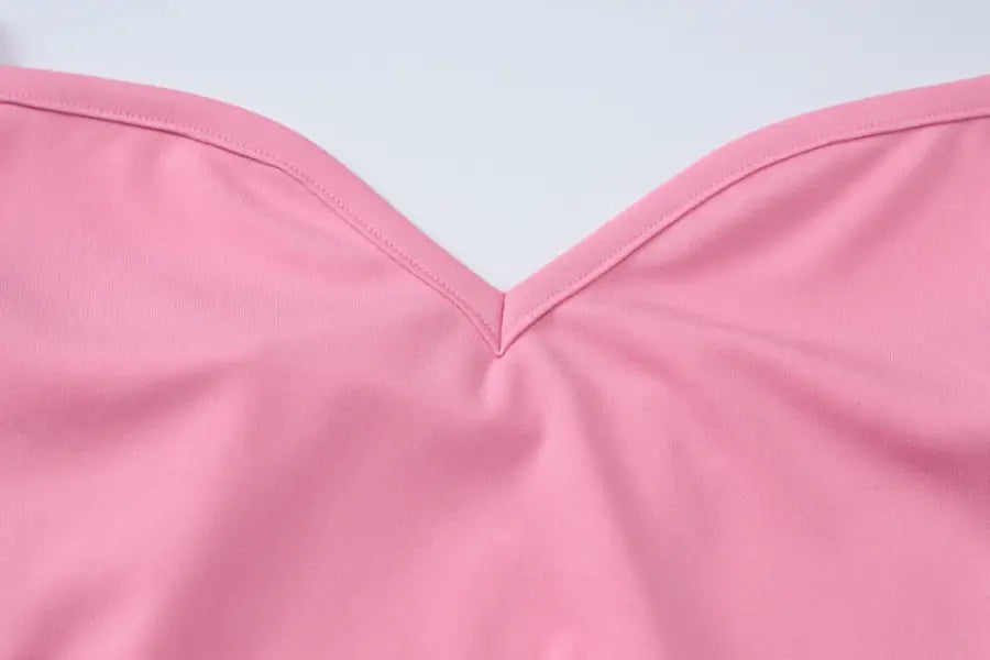 Pink V-neck garment showcasing an elegant halter high waist slim dress design