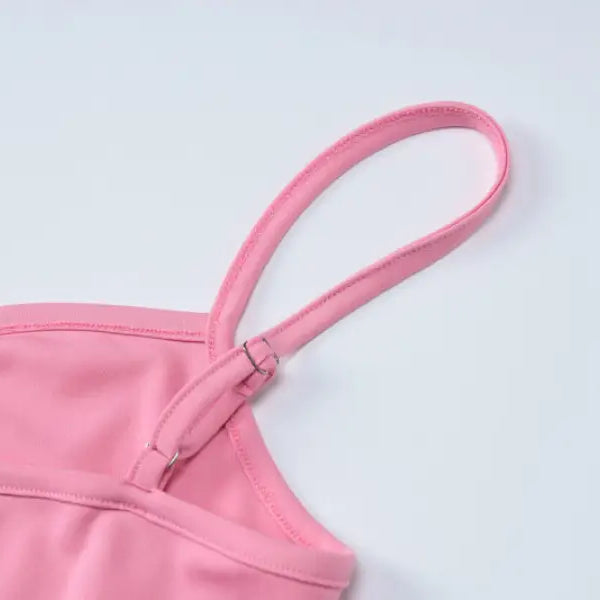 Pink camisole strap detail on an elegant halter high waist slim dress showcasing sophisticated design
