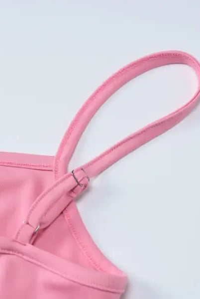 Pink camisole strap detail on an elegant halter high waist slim dress showcasing sophisticated design