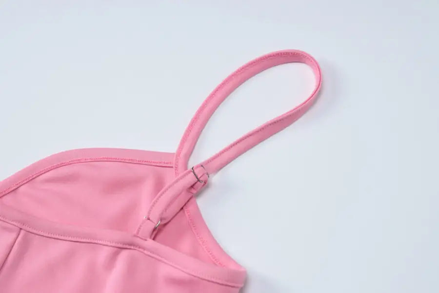 Pink camisole strap detail on an elegant halter high waist slim dress showcasing sophisticated design