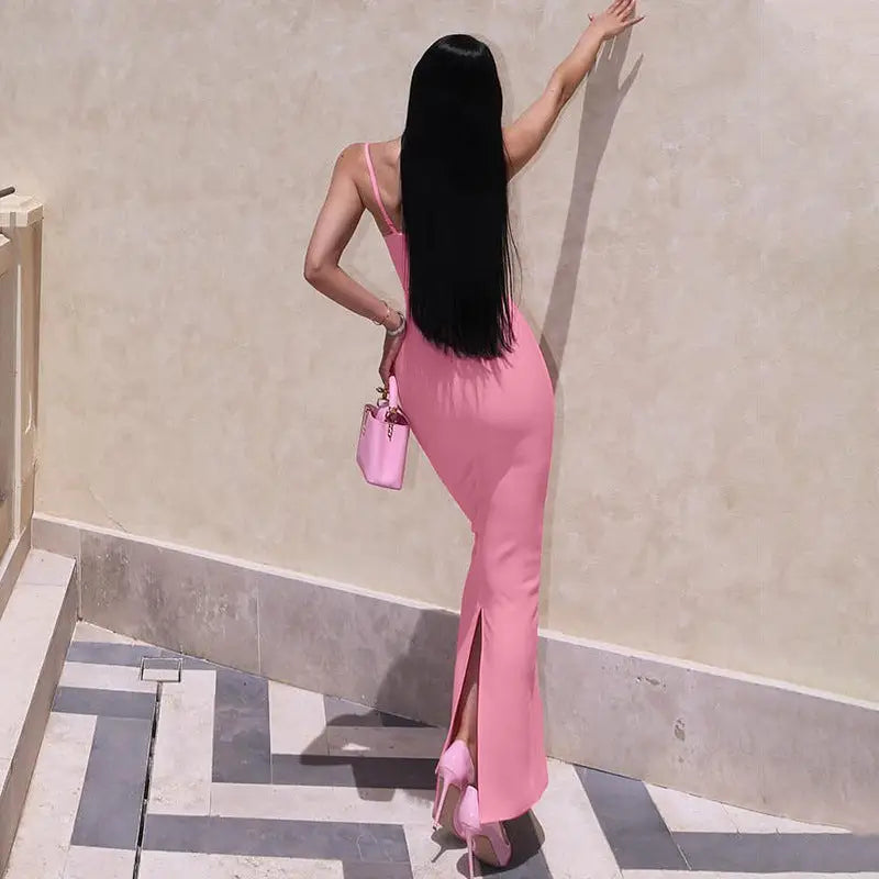 Elegant halter high waist slim dress in pink showcased by a woman in a sleeveless split maxi design