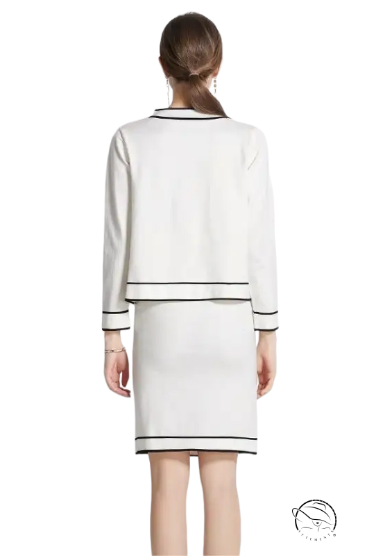 Elegant high rise long sleeve top with short skirt set in white with black trim