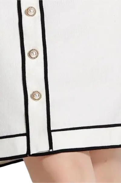 Elegant high rise long sleeve top with white skirt black trim gold buttons