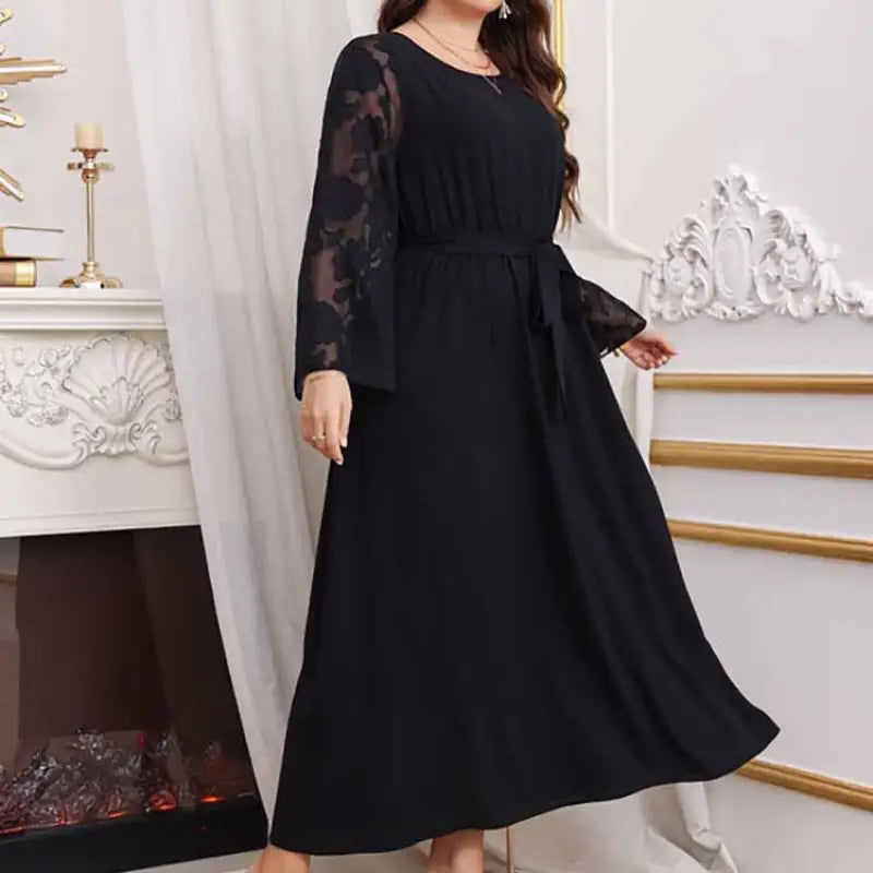 Elegant high waist black maxi dress with long sheer lace sleeves and tie waist