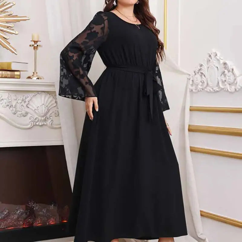 Elegant high waist black maxi dress with sheer floral lace bell sleeves and matching tie belt