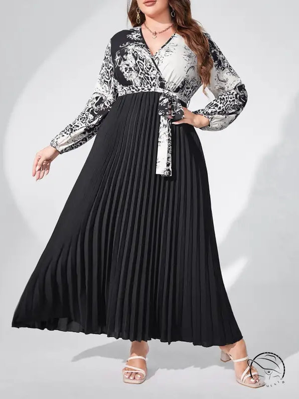Elegant high waist maxi dress with belted V-neck, lantern sleeves, black pleated skirt, and patterned top