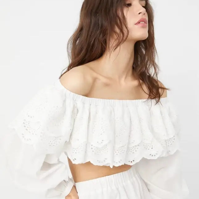 Woman wearing white organza jacquard ultra short high waist crop top with eyelet lace trim