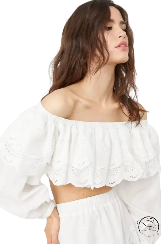 Woman in jacquard ultra short high waist crop top with eyelet lace trim