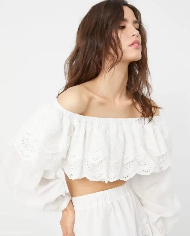 Woman wearing white organza jacquard ultra short high waist crop top with eyelet lace trim