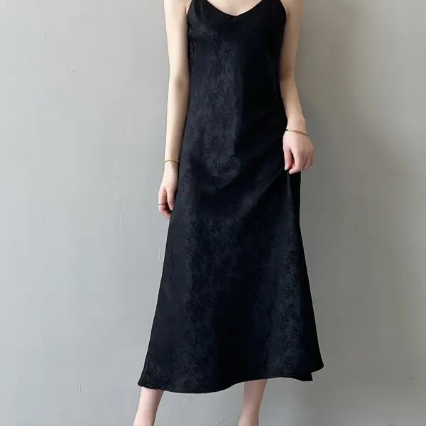 Elegant jacquard V-neck strap dress in black with flowing midi silhouette