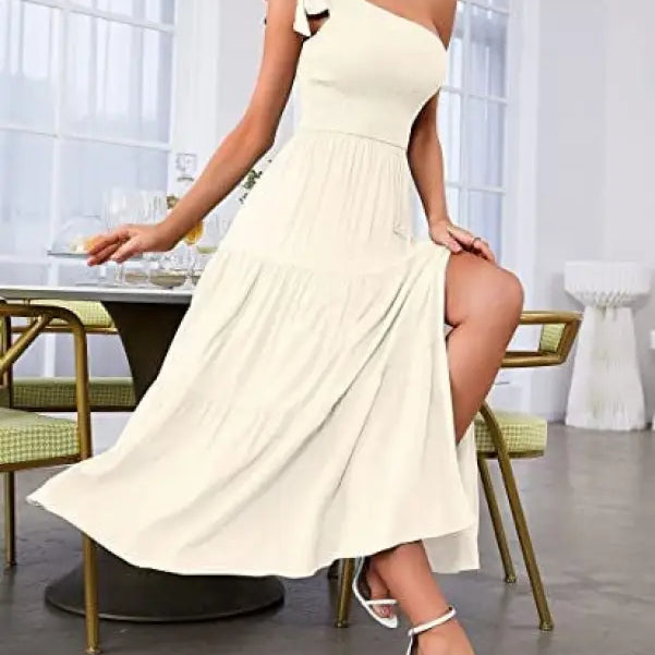 Cream-colored layered slit dress with shoulder pleated detailing and one-shoulder design