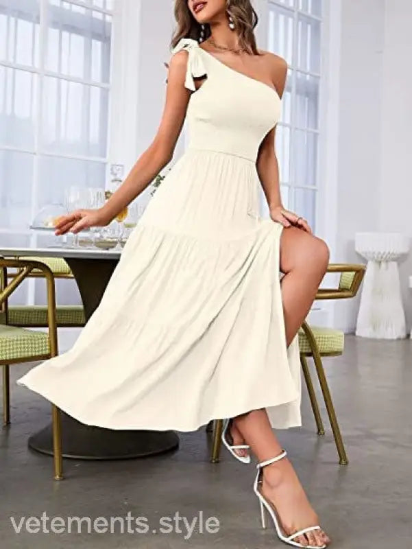 Cream-colored layered slit dress with shoulder pleated detailing and one-shoulder design