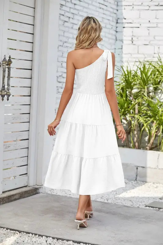 White one-shoulder pleated layered slit dress with tiered design for elegant occasions