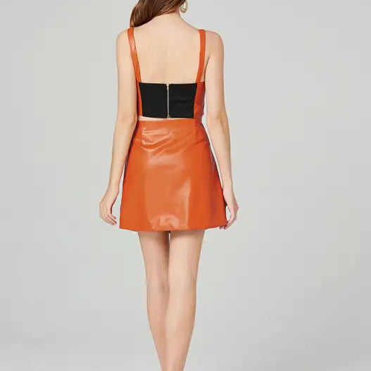 Orange faux leather two-piece set with zipper V-neck top and hip skirt for summer