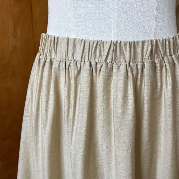 Beige elastic waist skirt paired with Elegant Lightweight Loose Tencel Midi Top