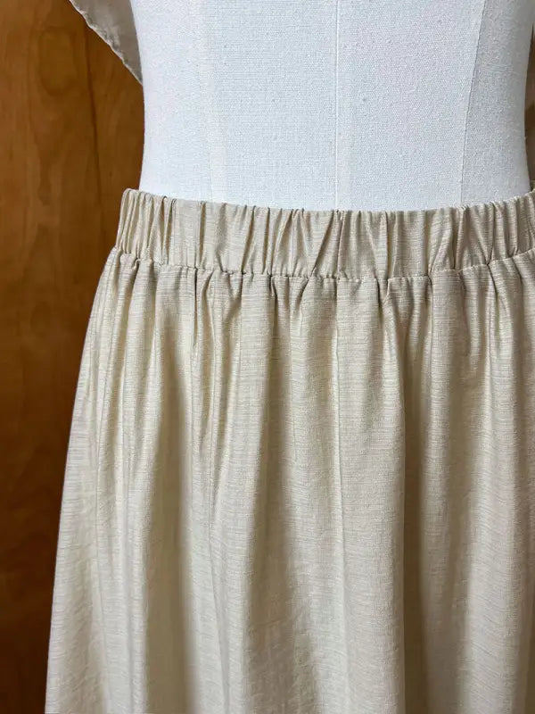 Beige elastic waist skirt paired with Elegant Lightweight Loose Tencel Midi Top
