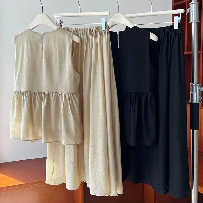 Two matching lightweight loose Tencel sets in advanced black, featuring a chic cutout design