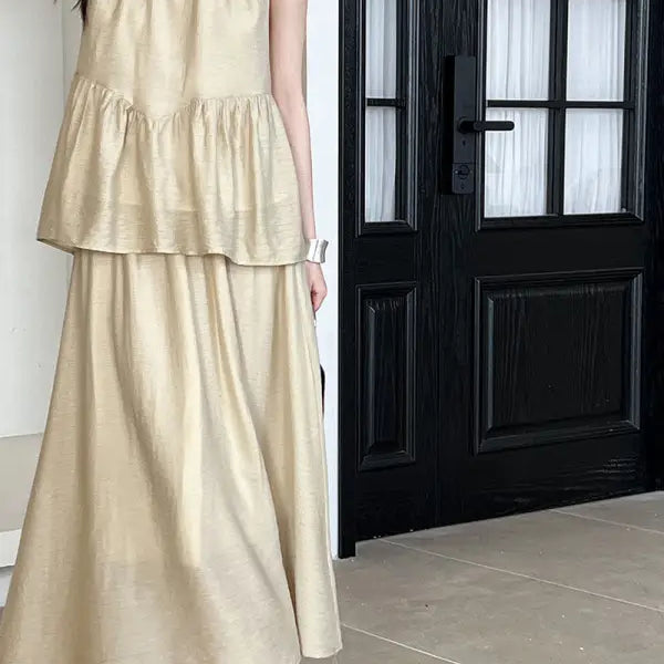 Beige two-piece dress featuring lightweight loose Tencel tiered top and cutout design