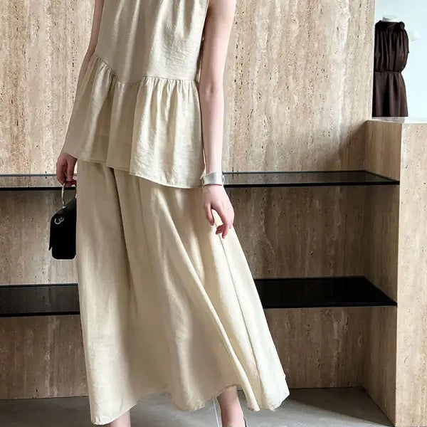 Beige linen two-piece loose Tencel suit featuring an elegant lightweight midi top design