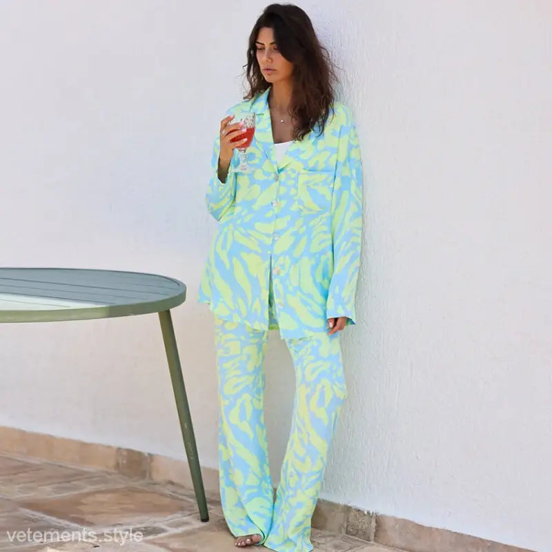 Woman in patterned long sleeve silk pajamas from Elegant Long Sleeve Silk Printed Lounge Set