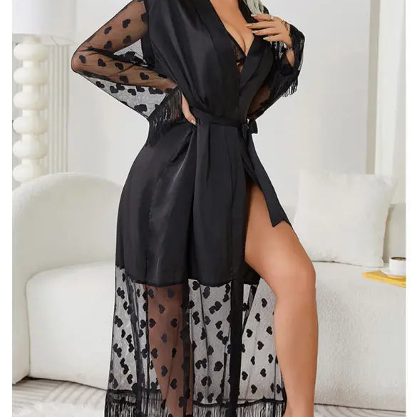 Black sheer robe with polka dot pattern and fringe trim.