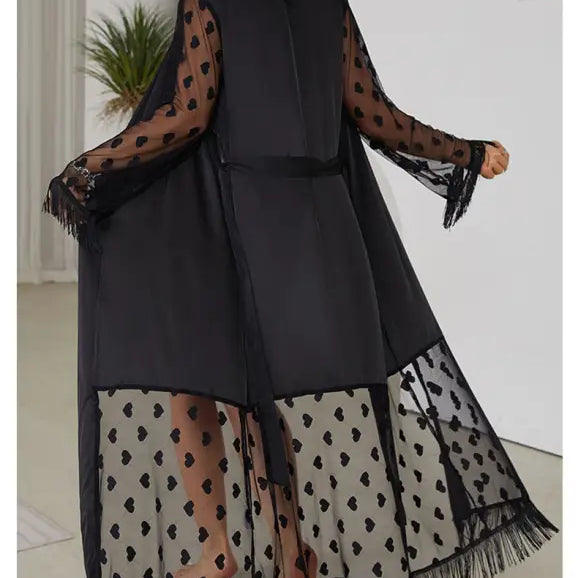 Long black sheer kimono-style robe with polka dot pattern and fringe trim.