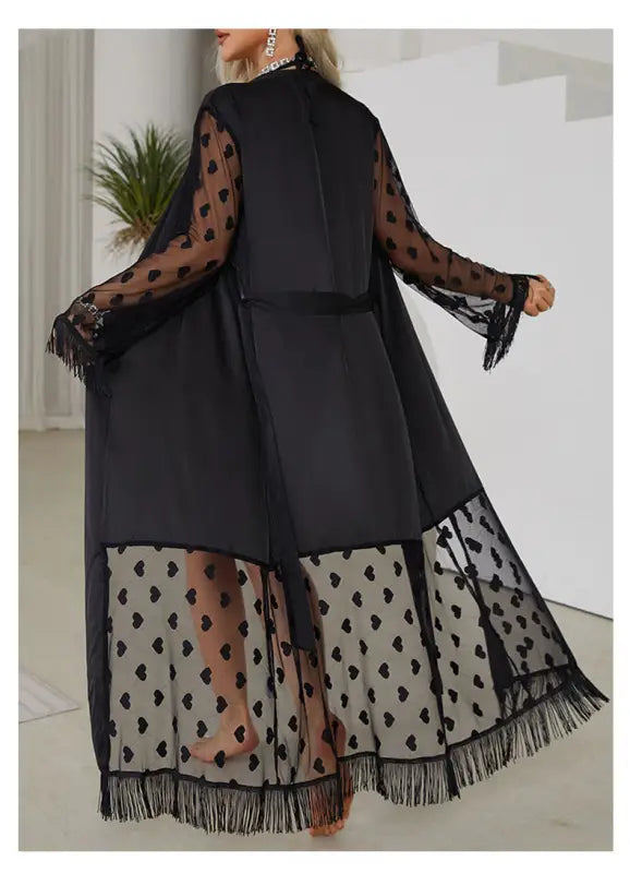 Long black sheer kimono-style robe with polka dot pattern and fringe trim.