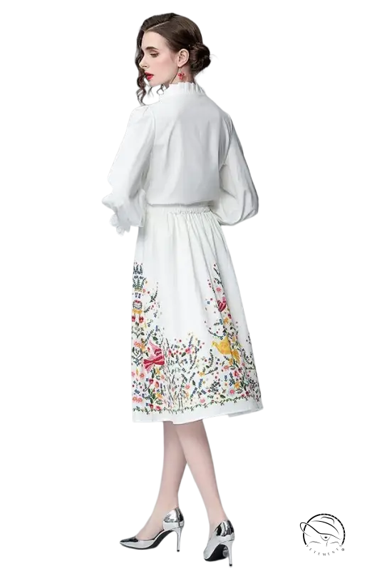 Elegant woman in white floral long sleeve two piece countryside dress