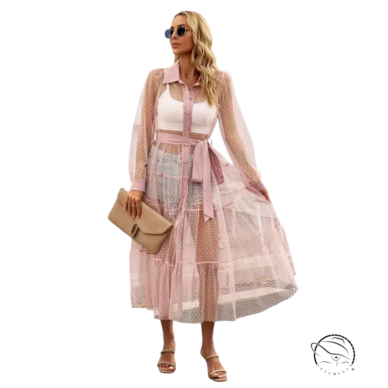 Woman in sheer pink polka dot summer mesh long sleeve waist dress